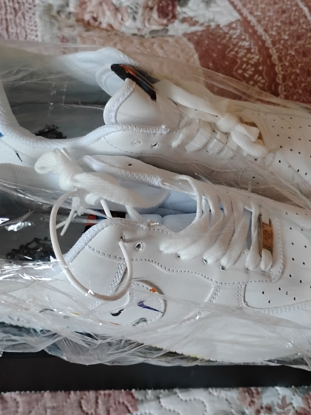 Nike White Low-Top Sneakers with Small Multicolor Swoosh